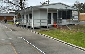 A picture containing outdoor, trailer, sky, property

Description automatically generated