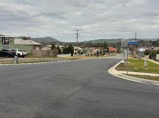 A road with a street sign

AI-generated content may be incorrect.