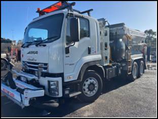 A white truck parked on the side of a road

AI-generated content may be incorrect.